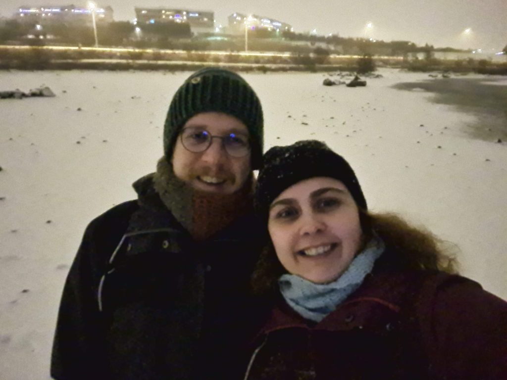 The author and her partner standing in the snow